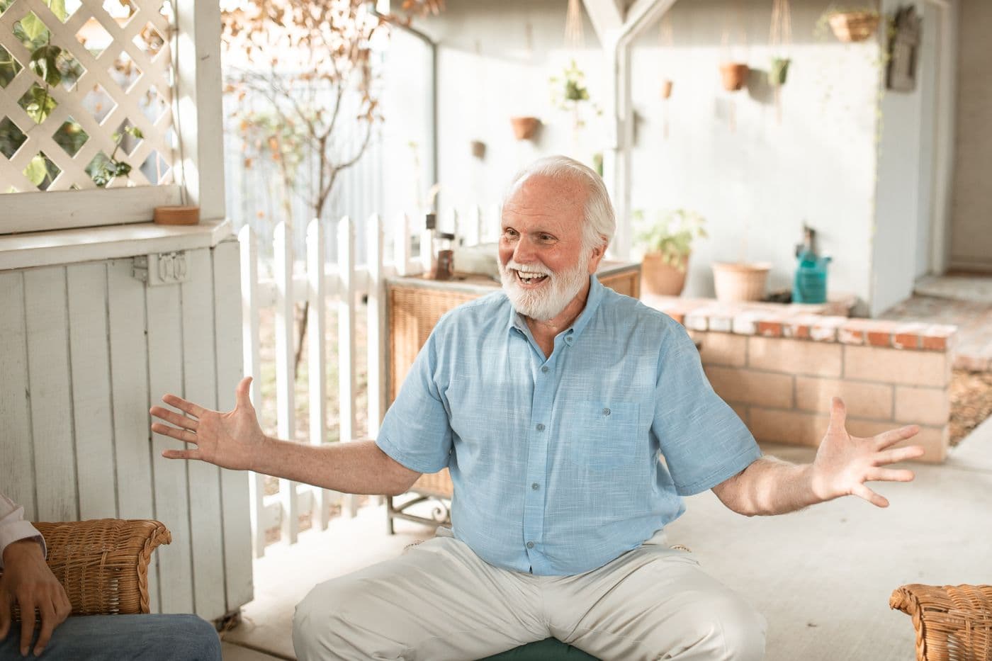 A homeowner standing on their own front porch, looking calm and relieved